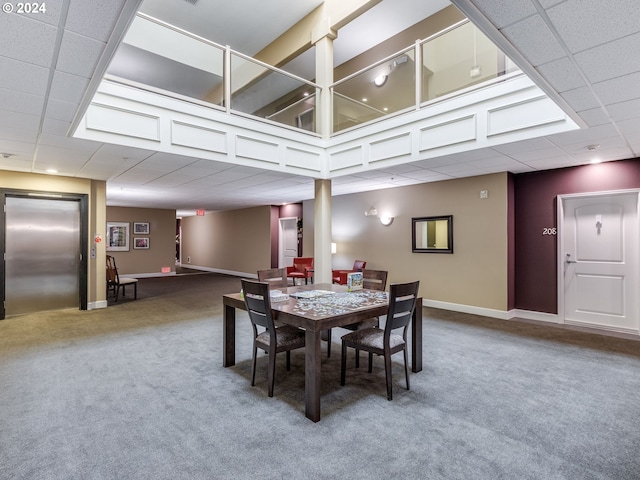 carpeted dining area featuring elevator