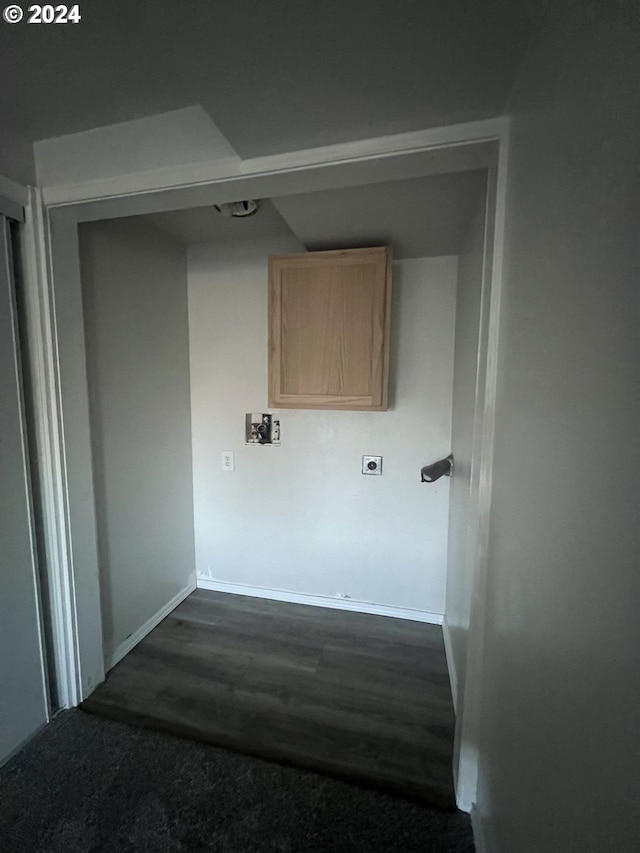 laundry room featuring hookup for an electric dryer and dark wood-type flooring