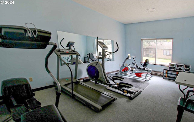 workout room with a textured ceiling