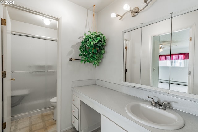 bathroom with toilet, ceiling fan, walk in shower, baseboard heating, and vanity