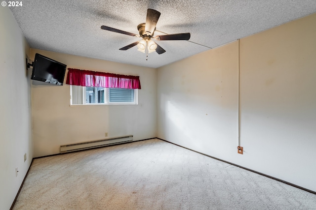 empty room featuring ceiling fan, carpet flooring, a textured ceiling, and a baseboard radiator