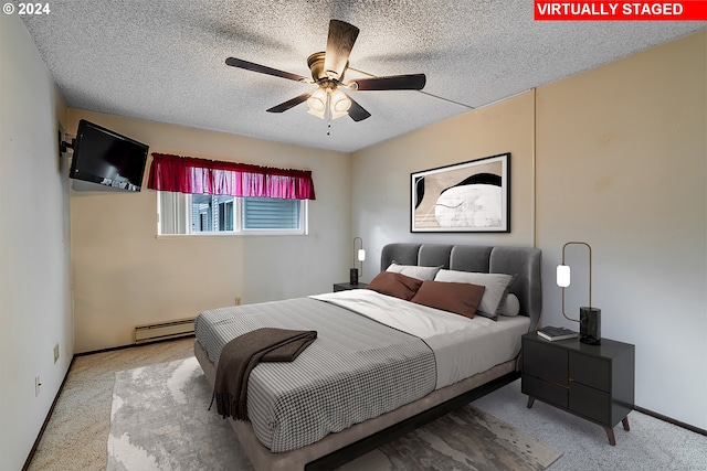 bedroom with light carpet, a textured ceiling, a baseboard radiator, and ceiling fan