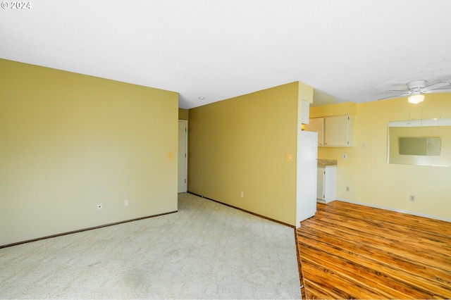 unfurnished room featuring ceiling fan and light hardwood / wood-style flooring