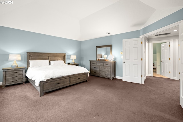 carpeted bedroom with vaulted ceiling