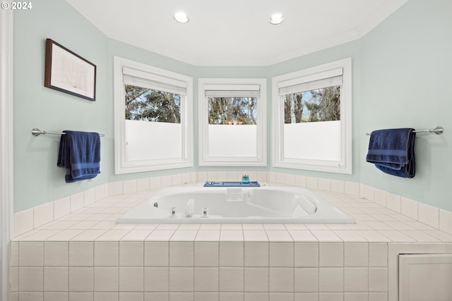 bathroom featuring tiled tub, a wealth of natural light, and crown molding