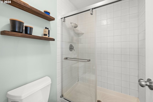 bathroom with toilet and walk in shower