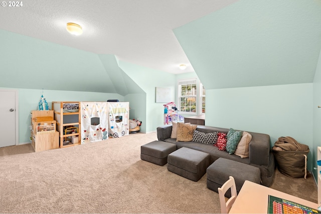 carpeted living room with a textured ceiling and lofted ceiling