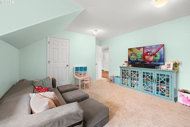 carpeted living room featuring lofted ceiling and a textured ceiling