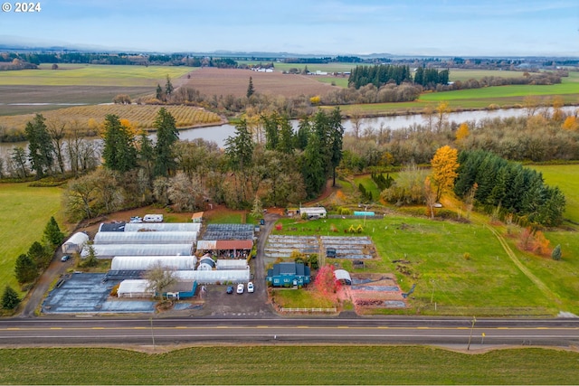 aerial view with a rural view and a water view