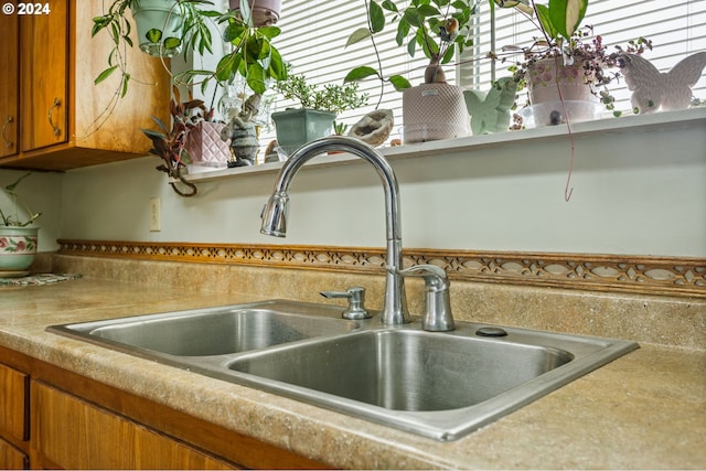 30274 Peoria Rd, Shedd, OR 97377 - kitchen view of a sink, brown cabinetry, and light countertops