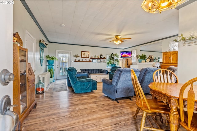 30274 Peoria Rd, Shedd, OR 97377 - living room featuring light wood finished floors, ornamental molding, ceiling fan, and a chandelier