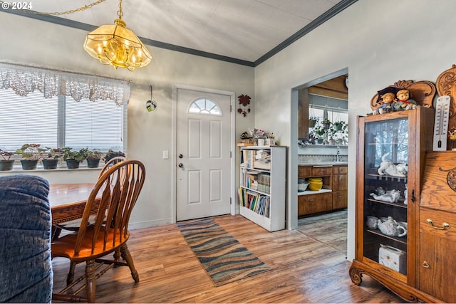 30274 Peoria Rd, Shedd, OR 97377 - foyer entrance with a chandelier, crown molding, and light wood-type flooring