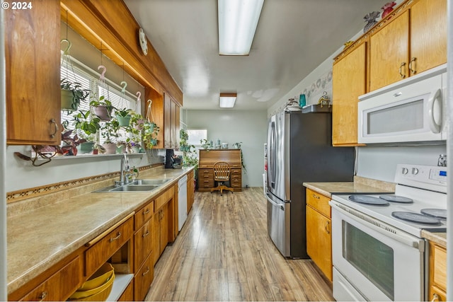 30274 Peoria Rd, Shedd, OR 97377 - kitchen with white appliances, a sink, light wood finished floors, light countertops, and brown cabinets