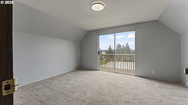 976 E St, Coos Bay, OR 97420 - additional living space featuring vaulted ceiling, carpet floors, and a textured ceiling