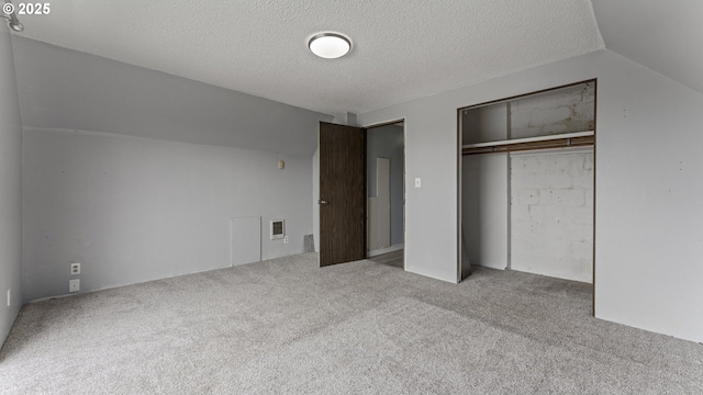 976 E St, Coos Bay, OR 97420 - unfurnished bedroom with carpet floors, a closet, and a textured ceiling