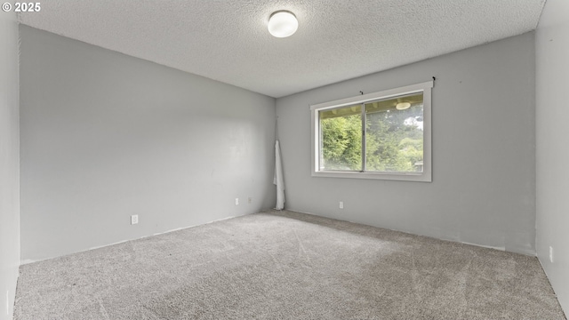 976 E St, Coos Bay, OR 97420 - spare room featuring carpet and a textured ceiling