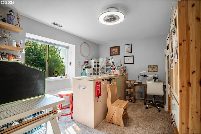 home office with light carpet and visible vents