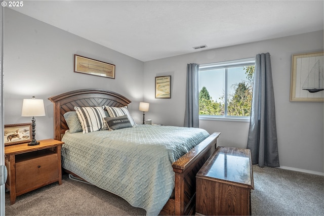 bedroom featuring carpet floors, baseboards, and visible vents