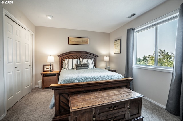 carpeted bedroom with a closet