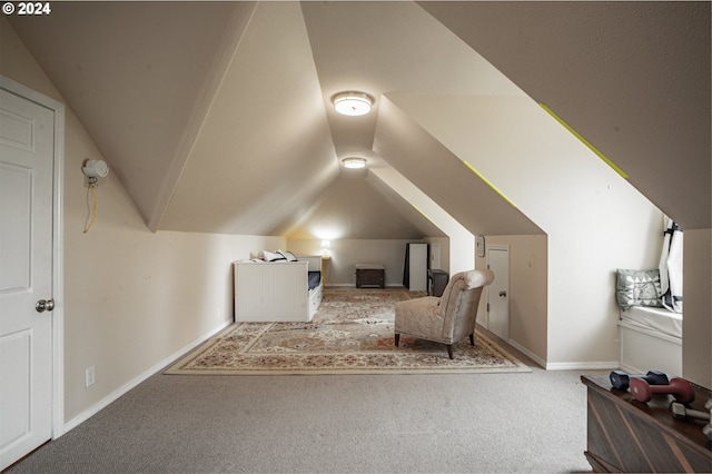 bedroom featuring vaulted ceiling and carpet floors