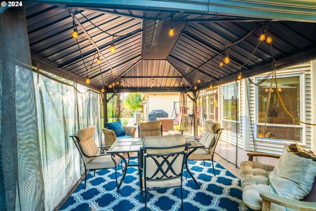 deck featuring grilling area and a gazebo