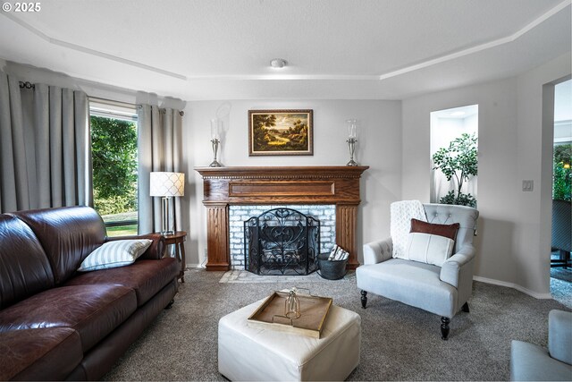 carpeted living room featuring a brick fireplace