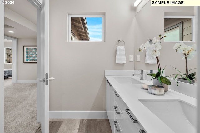 bathroom featuring vanity and hardwood / wood-style floors