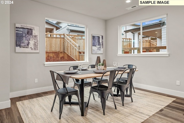 dining room with hardwood / wood-style floors