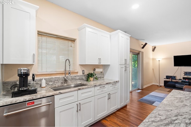 kitchen with white cabinetry, sink, stainless steel dishwasher, and dark hardwood / wood-style flooring