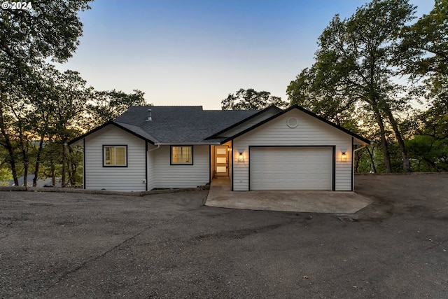 single story home featuring a garage