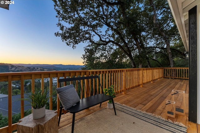 deck at dusk with a mountain view