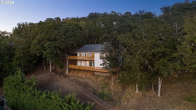 back of house with a balcony