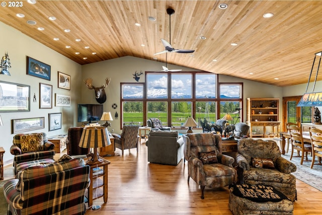 living room with lofted ceiling, wooden ceiling, ceiling fan, and light wood-type flooring