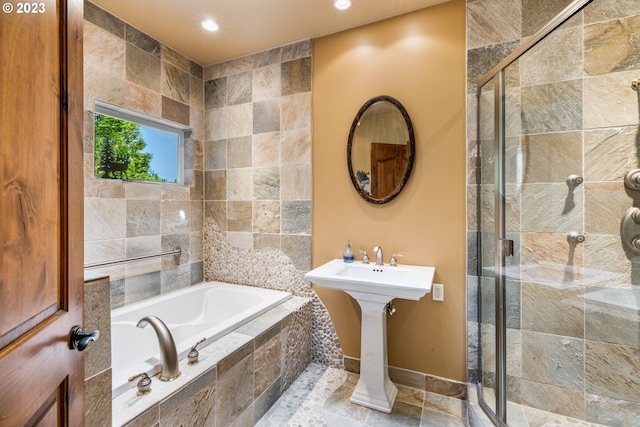 bathroom with tile walls, tile floors, and plus walk in shower