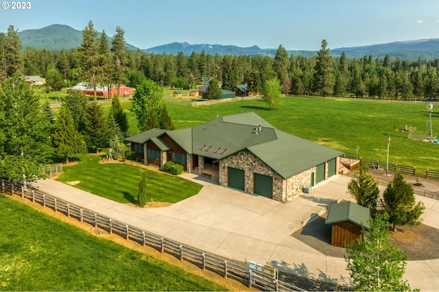 birds eye view of property with a rural view and a mountain view