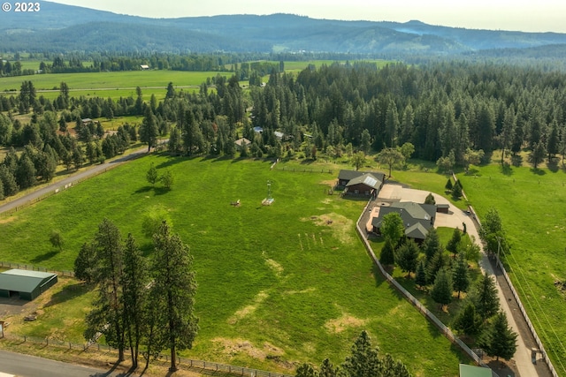 birds eye view of property with a mountain view and a rural view