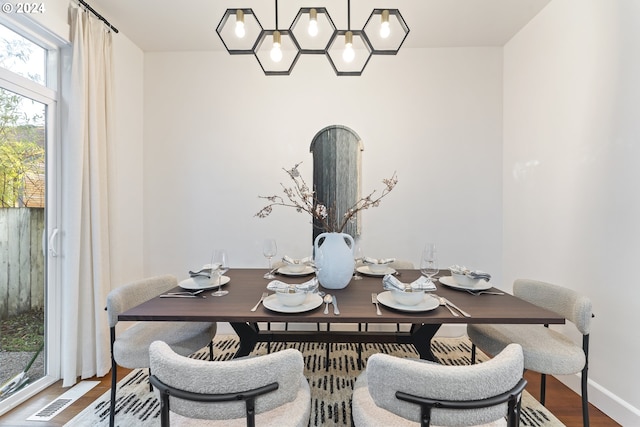 dining area with wood-type flooring