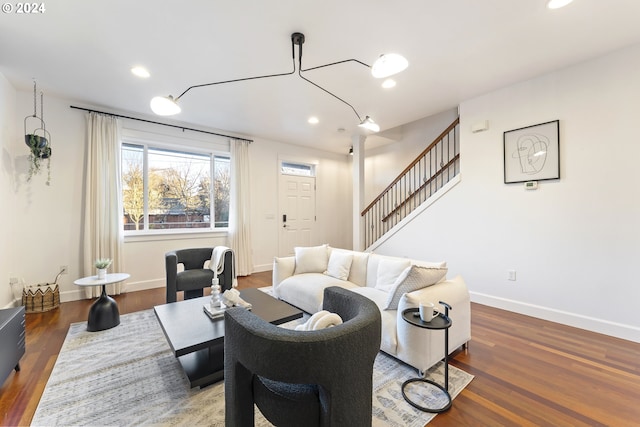 living room with dark hardwood / wood-style flooring