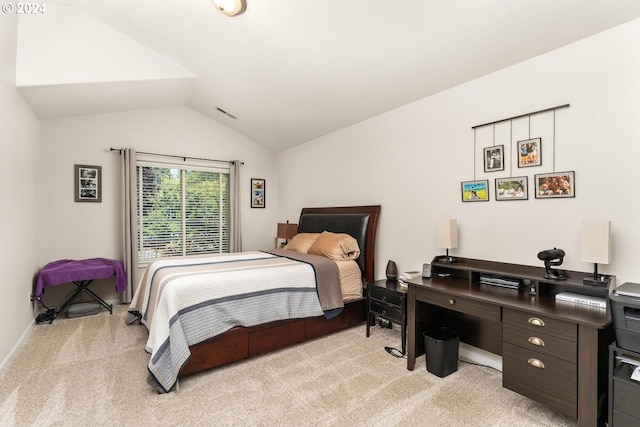 carpeted bedroom featuring vaulted ceiling