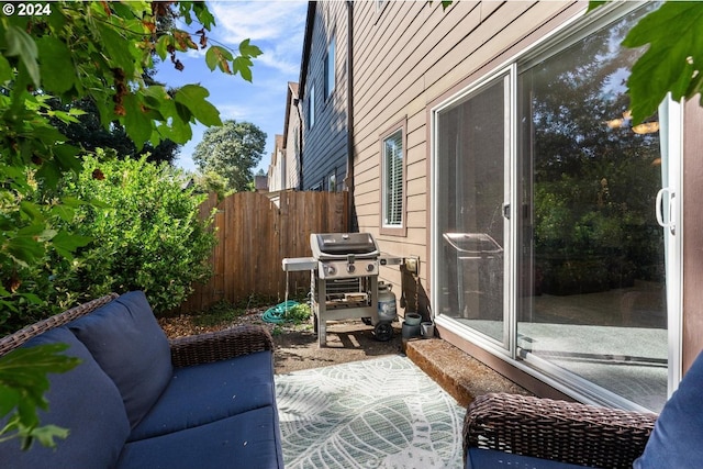 view of property exterior with an outdoor hangout area and a patio