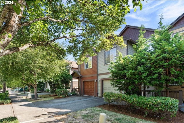 view of front of house featuring a garage and concrete driveway