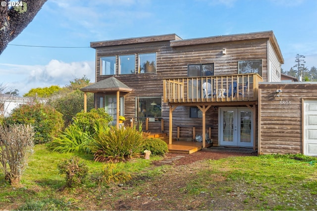 back of house with a deck and french doors