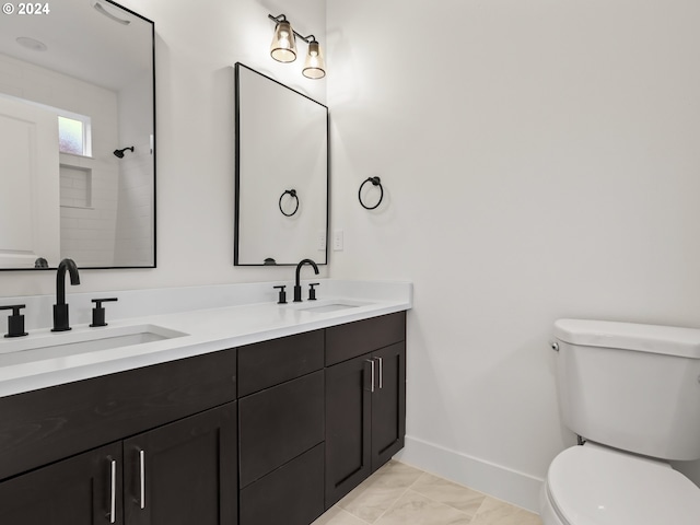 bathroom featuring walk in shower, vanity, and toilet