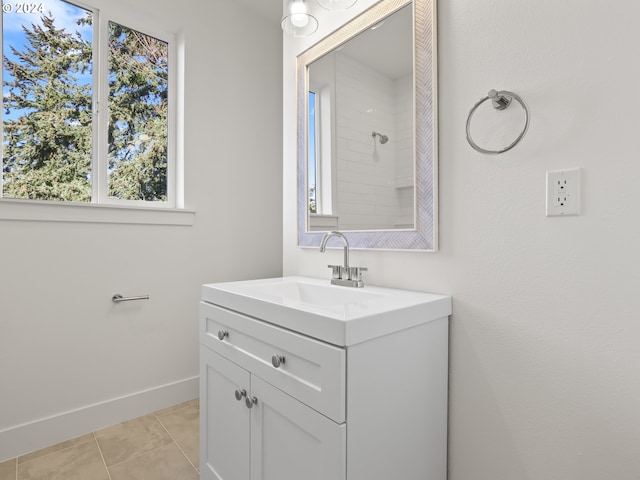 bathroom featuring tile patterned flooring and vanity