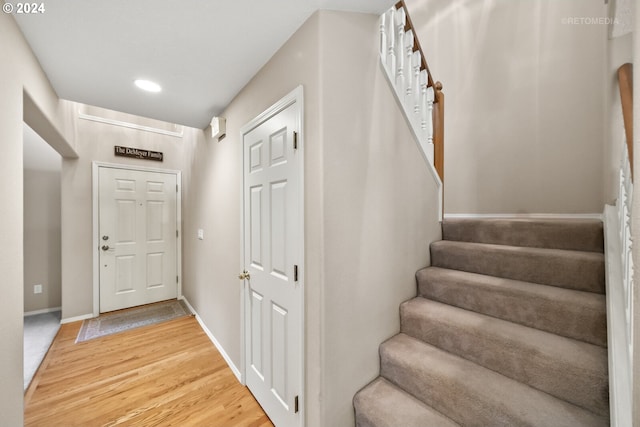 stairs with wood-type flooring