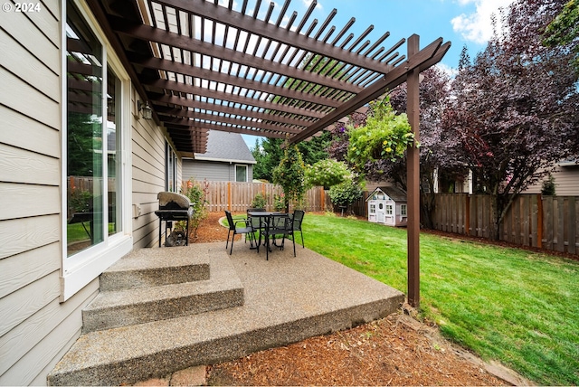 view of patio featuring grilling area, a pergola, and a storage unit