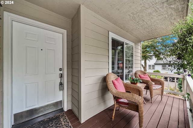 doorway to property featuring covered porch