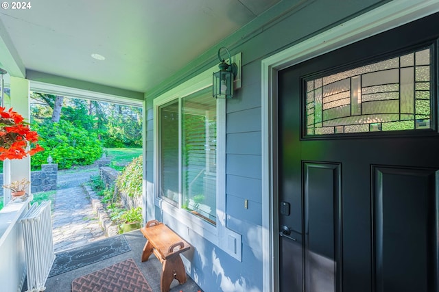 property entrance with covered porch