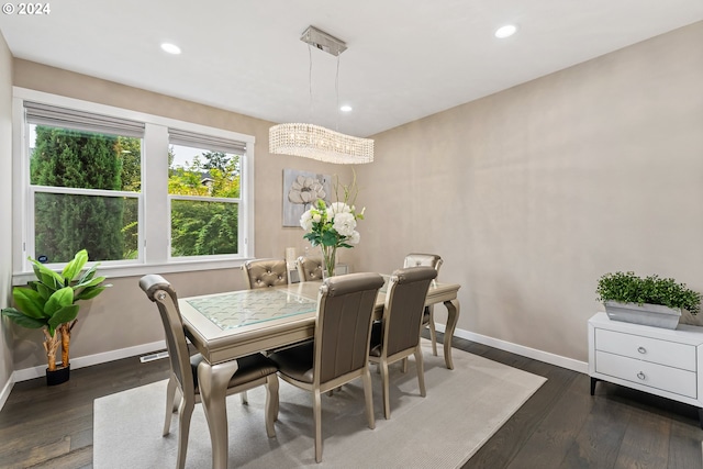 dining room featuring baseboards, dark wood finished floors, and recessed lighting