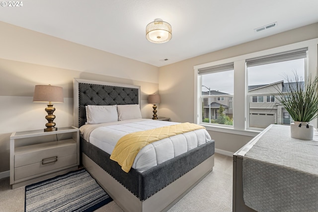 bedroom with visible vents and baseboards